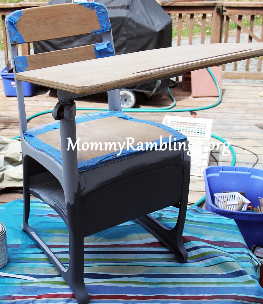 Priming the metal, don't mind the huge mess I work in with all my stuff.  I also recycle old tablecloths as drop cloths.